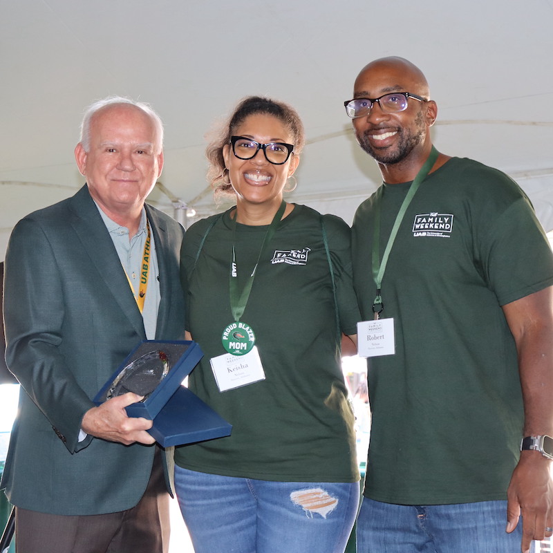 Dr. Ray Watts with Family of the Year Award winner